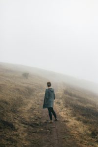 Woman looking into the fog.